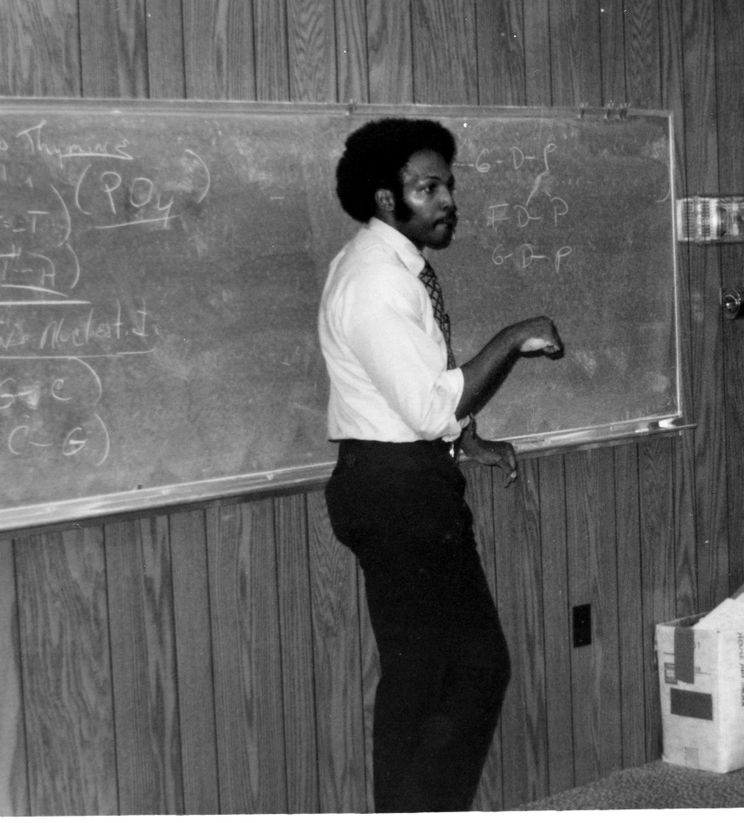 PHSC Instructor, Dr. Floyd, at blackboard teaching class in early 1970s