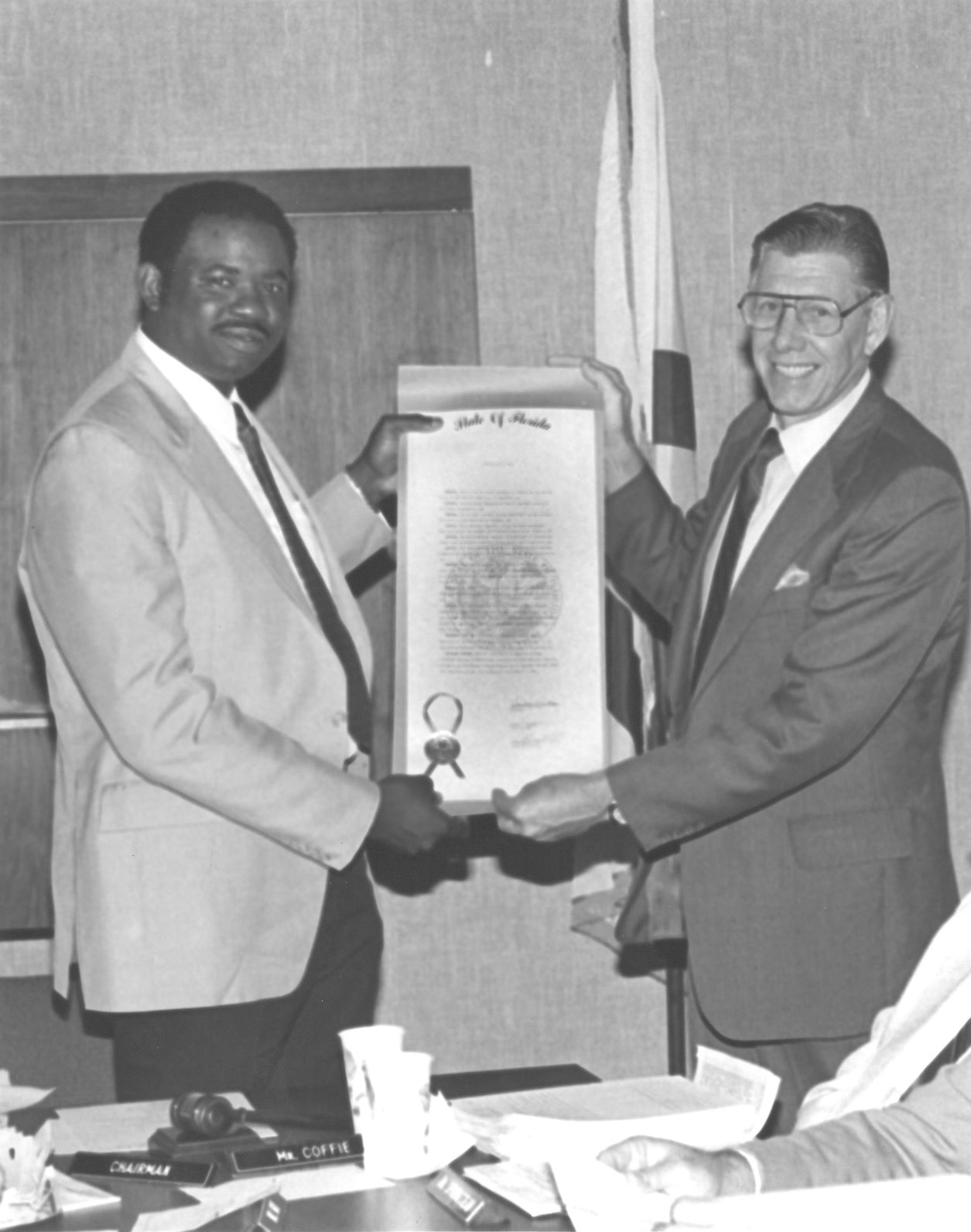 1986-87 District Board of Trustee Lorenzo Coffie and Milton O. Jones exhibiting Pasco-Hernando Community College Charter