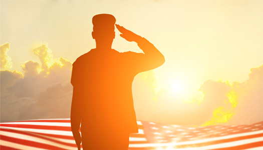 silhouette of military person saluting toward the american flag and the sun