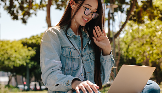 asian female looking on laptop