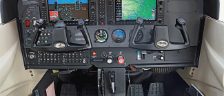 Aircraft cockpit showing control wheels and instrument panel