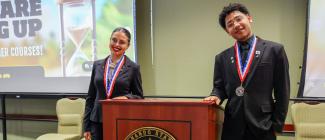 Two PHSC students dressed in business attire