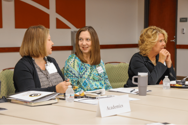 Ann Skilton,  Patricia Stewart, DNP, and Michele Sumner collaborating and exchanging ideas.