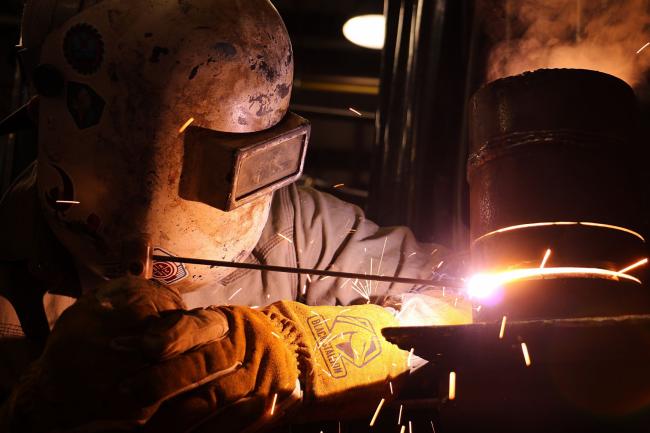 PHSC welding program student doing a welding activity.