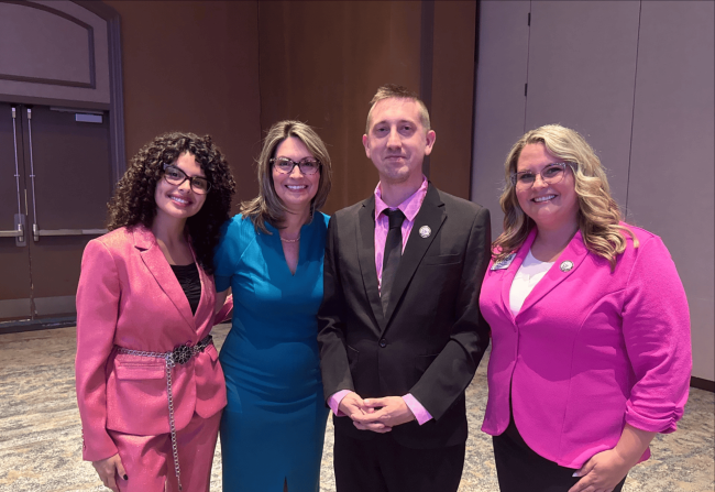 FBLA students, advisor and ceo posing for photo.