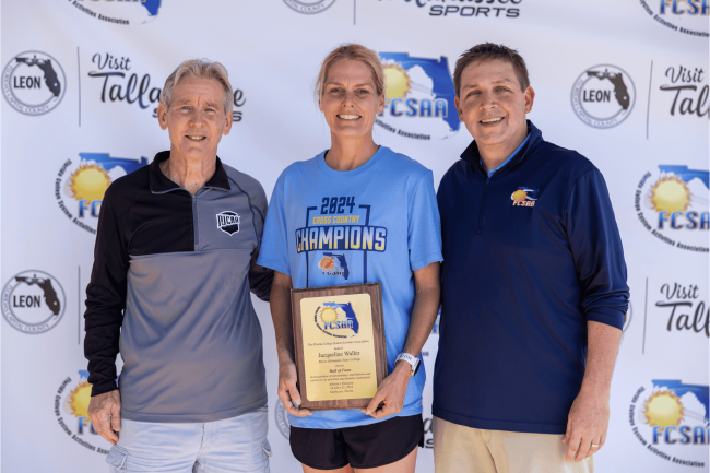 Jacki Waller holding her FCSAA Hall of Fame Award with Steve Winterling and Rob Chaney