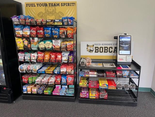 Shelf of Snacks and Self Pay Machine