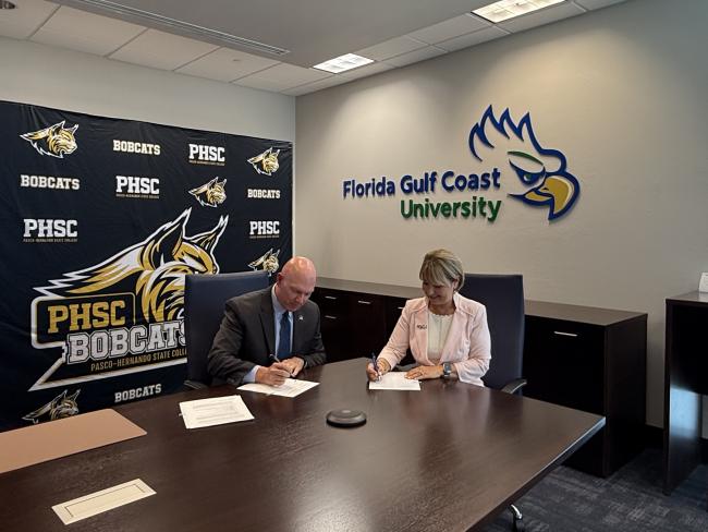 Eric Hall, Ed.D., PHSC President and Aysegul Timur, Ph.D. FGCU President, signing MOU