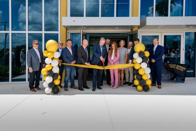 Wilton Simpson cutting the ribbon with PHSC DBoT members
