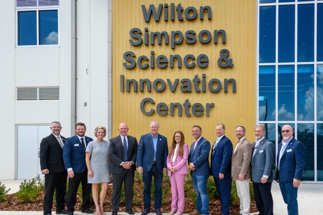 Wilton Simpson and PHSC DBoT standing in front of the newly opened Wilton Simpson Science &amp; Innovation Center