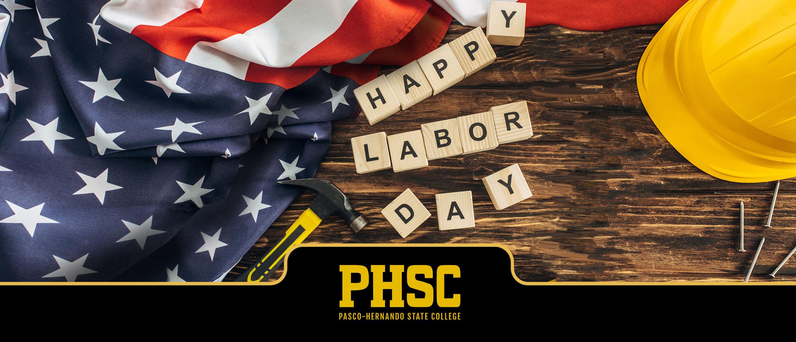 The U.S. flag and tools on top of a table with text stating "Happy Labor Day"